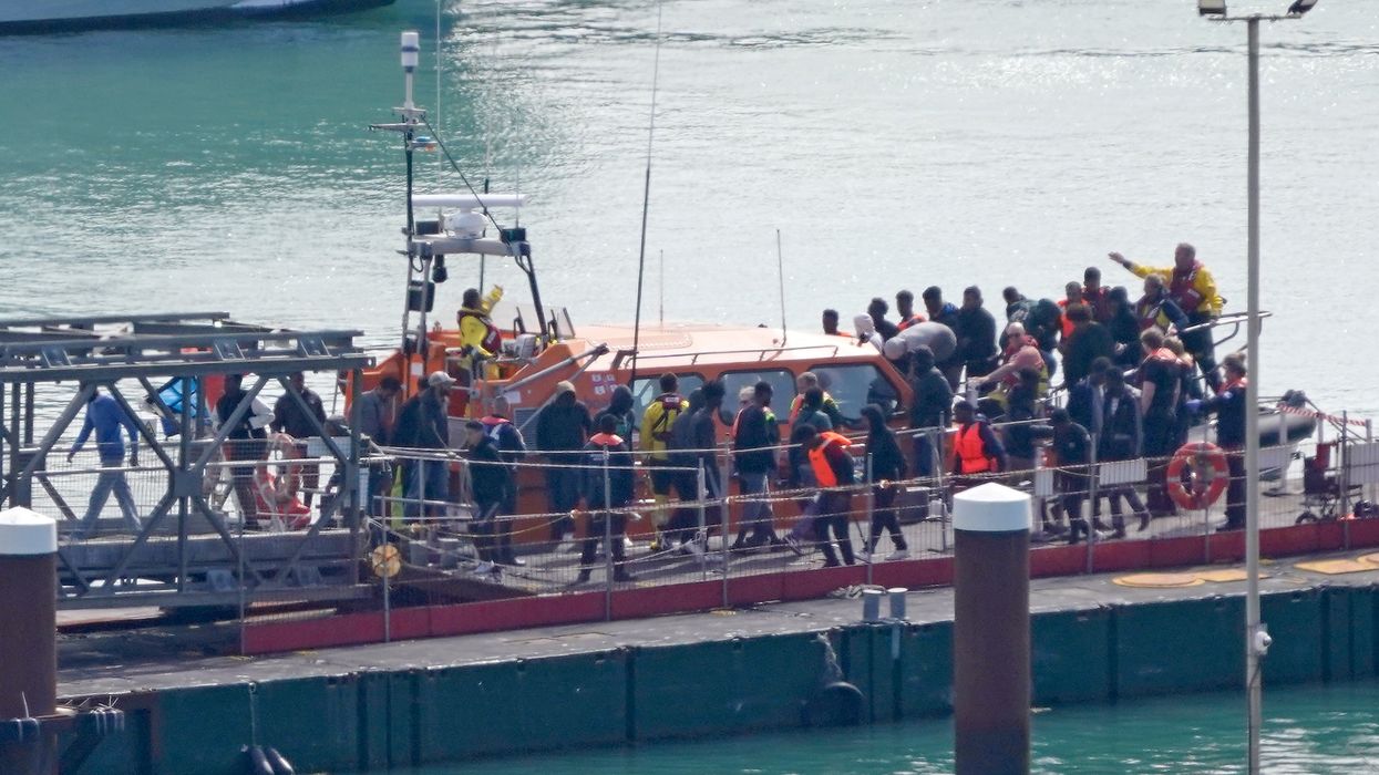 A group of people thought to be migrants are brought in to Dover, Kent