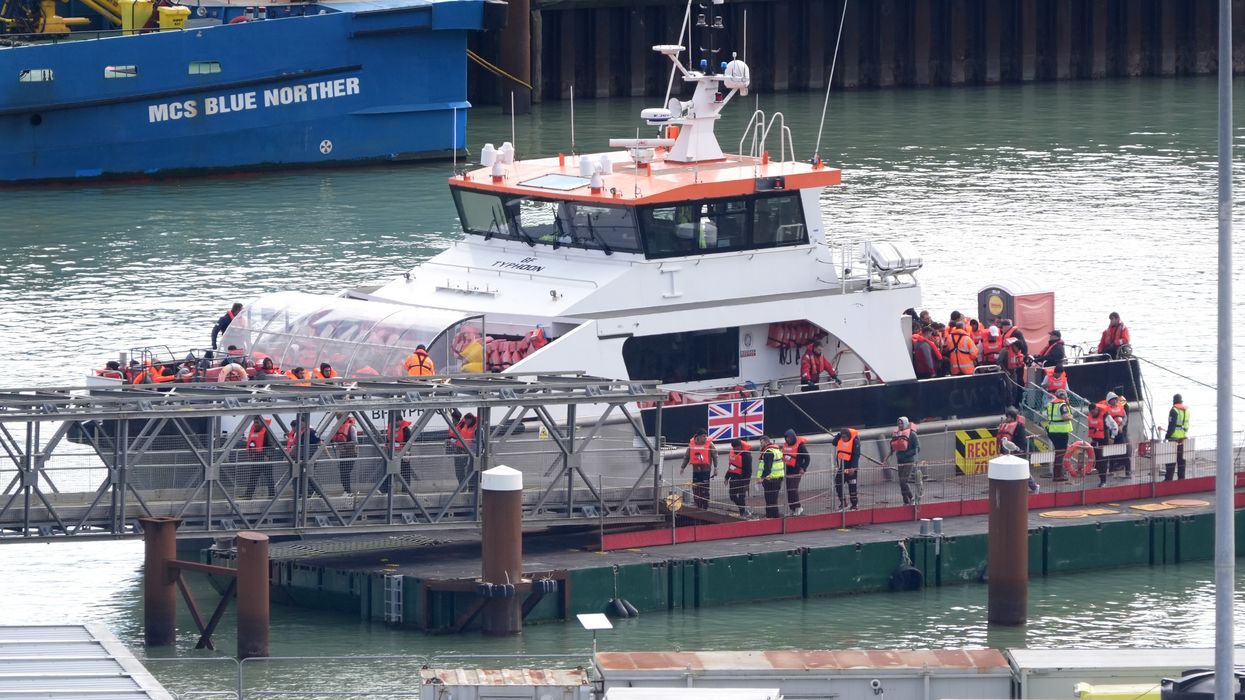 A group of people thought to be migrants are brought in to Dover, Kent