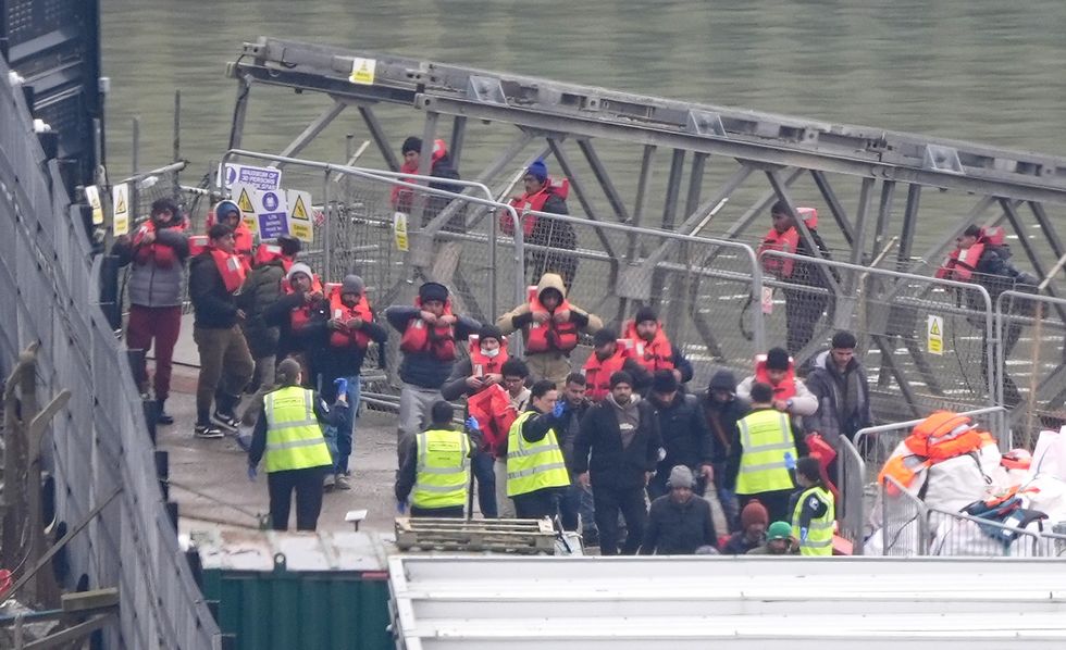 A group of people thought to be migrants are brought in to Dover, Kent