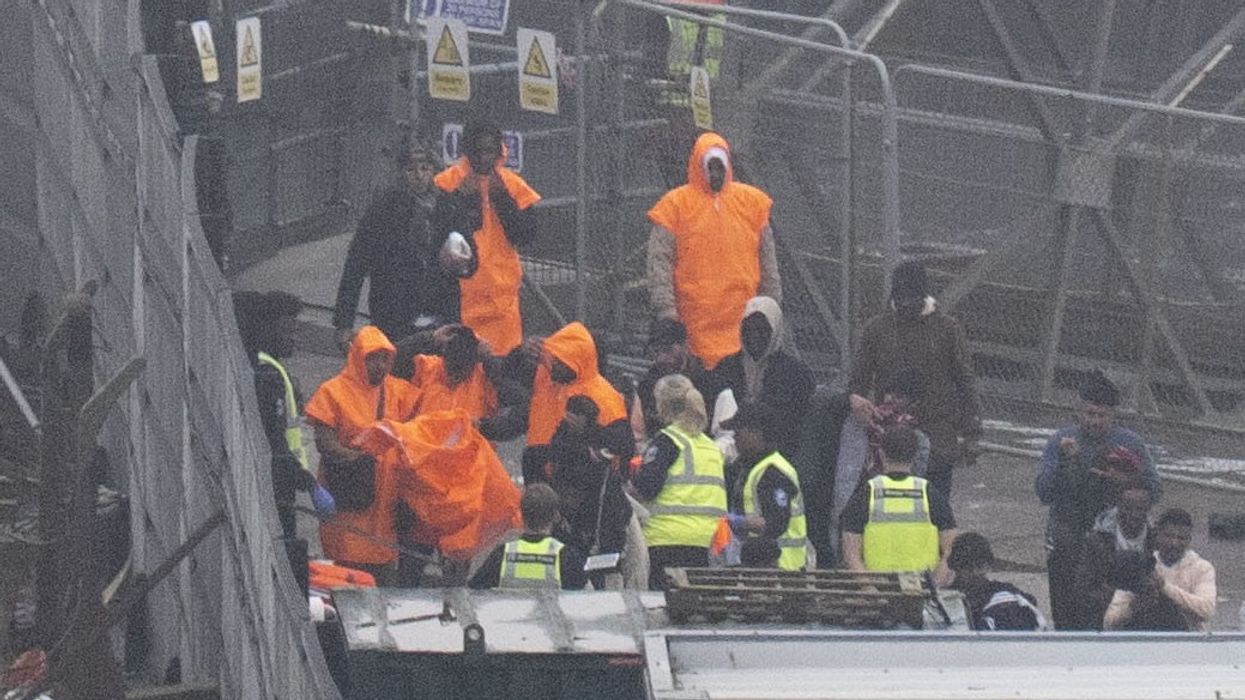 A group of people thought to be migrants are brought in to Dover, Kent