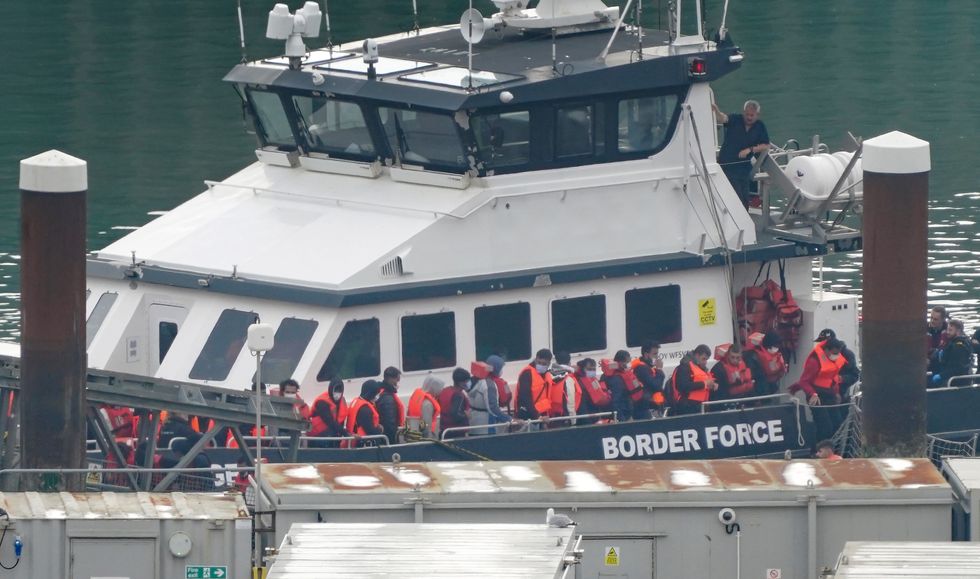 A group of people thought to be migrants are brought in to Dover