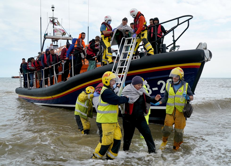 A group of people thought to be migrants are brought in to Dungeness, Kent, after being rescued by the RNLI following a small boat incident in the Channel. Picture date: Thursday September 15, 2022.