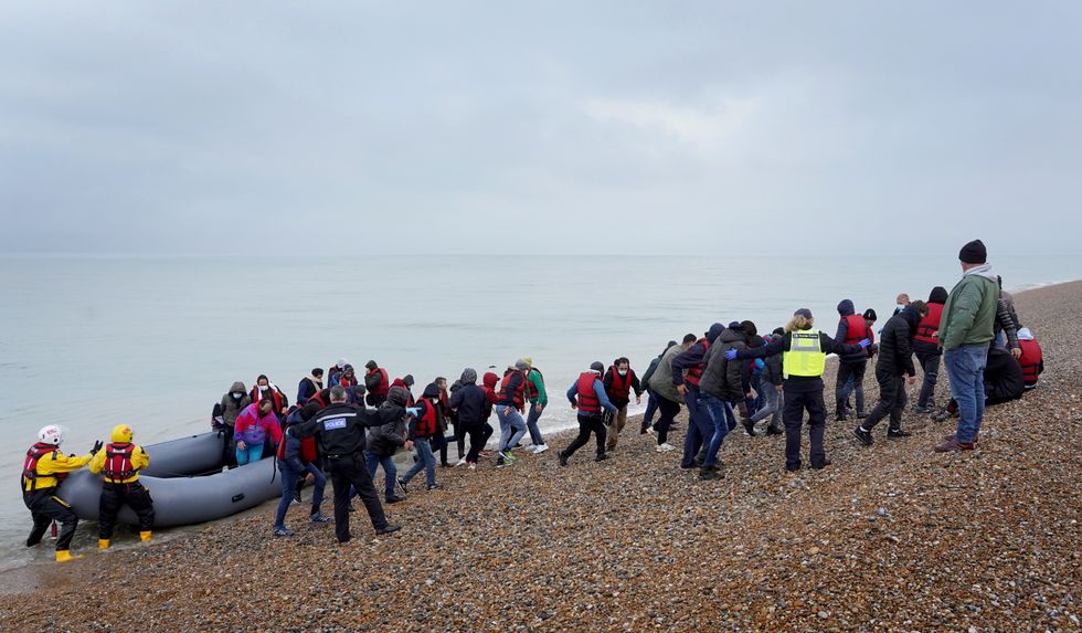 A group of people thought to be migrants are brought in to Dungeness, Kent, by the RNLI following a small boat incident in the Channel.