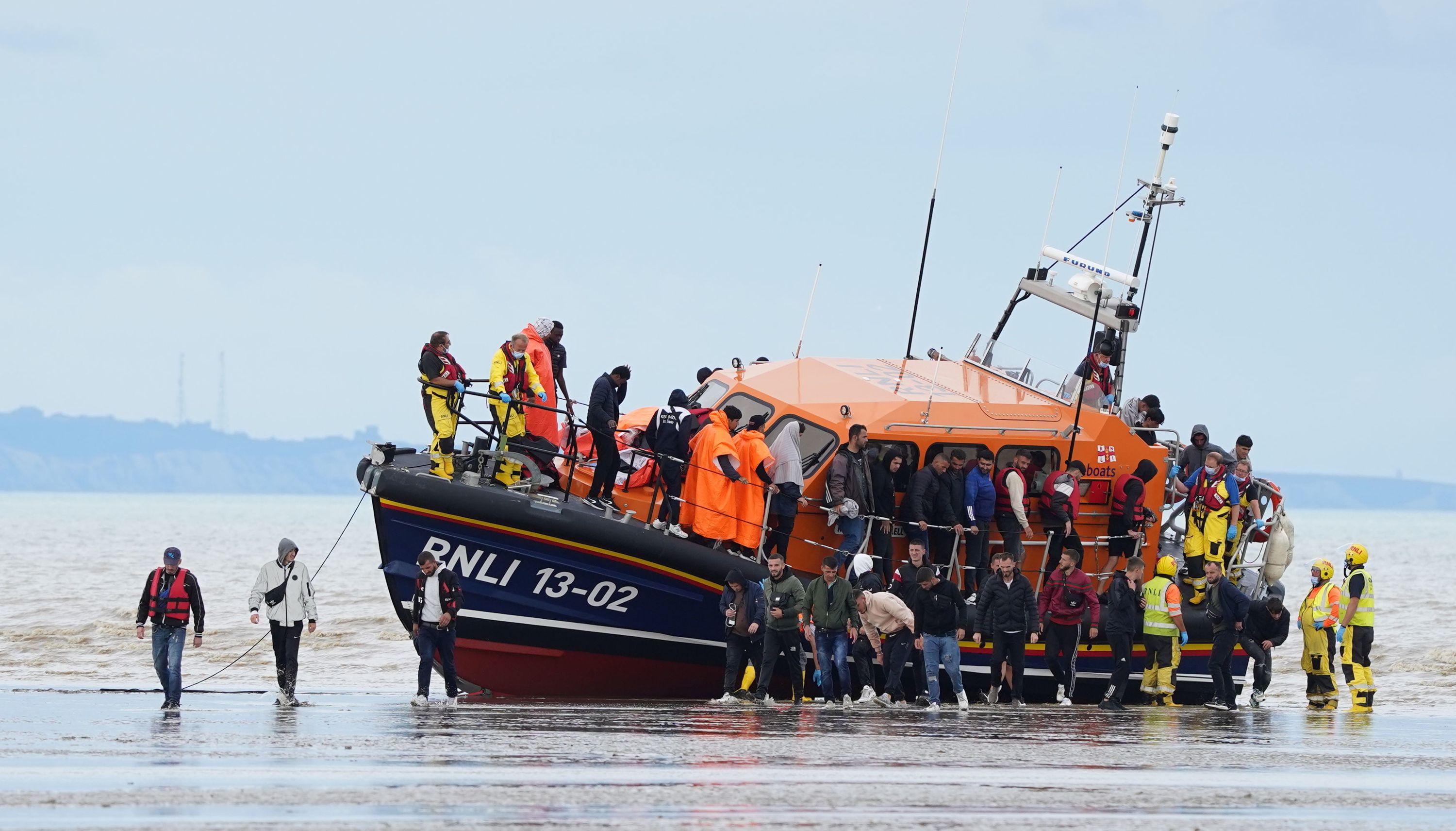 A group of people thought to be migrants are brought in to Dungeness, Kent, by the RNLI, following a small boat incident in the Channel.