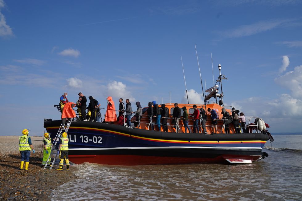 A group of people thought to be migrants are brought in to Dungeness, Kent