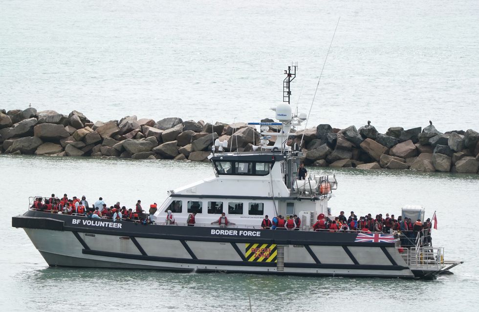 A group of people thought to be migrants are brought in to Ramsgate, Kent, onboard a Border Force vessel following a small boat incident in the Channel. Picture date: Monday August 1, 2022.