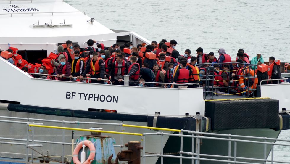 A group of people thought to be migrants are brought in to Ramsgate, Kent, onboard a Border Force vessel.