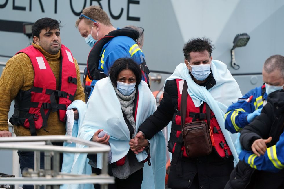 A group of people thought to be migrants as they are brought in to Dover, Kent, by Border Force officers following a small boat incident in the Channel. Picture date: Thursday March 3, 2022.