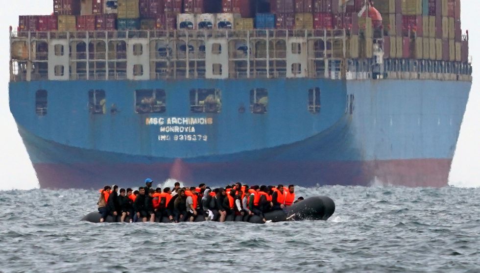 A group of people thought to be migrants crossing the Channel in a small boat traveling from the coast of France