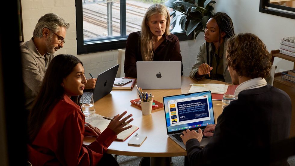 A group of people working from the new MacBook Pro