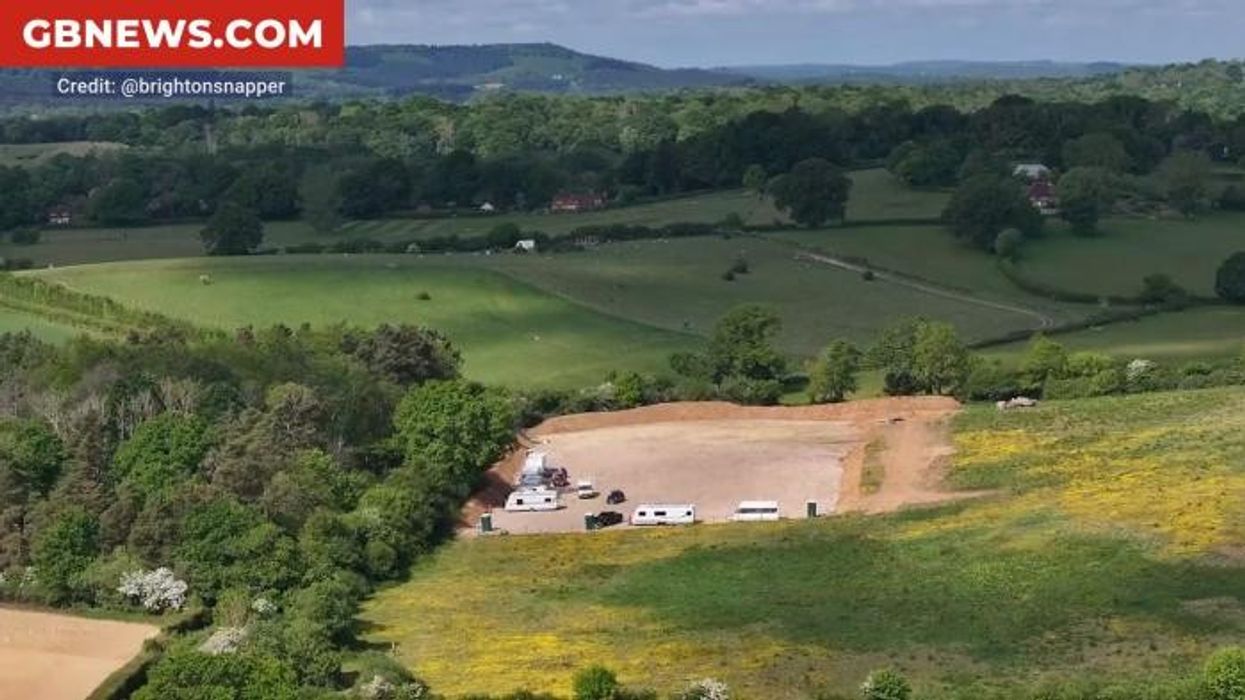 Neighbour row erupts as travellers take over huge field with fleet of caravans