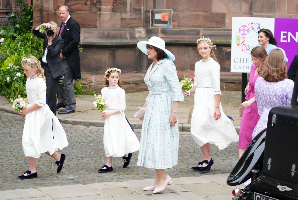A guest arrives for the wedding of Hugh Grosvenor, the Duke of Westminster, to Olivia Henson at Chester Cathedral.