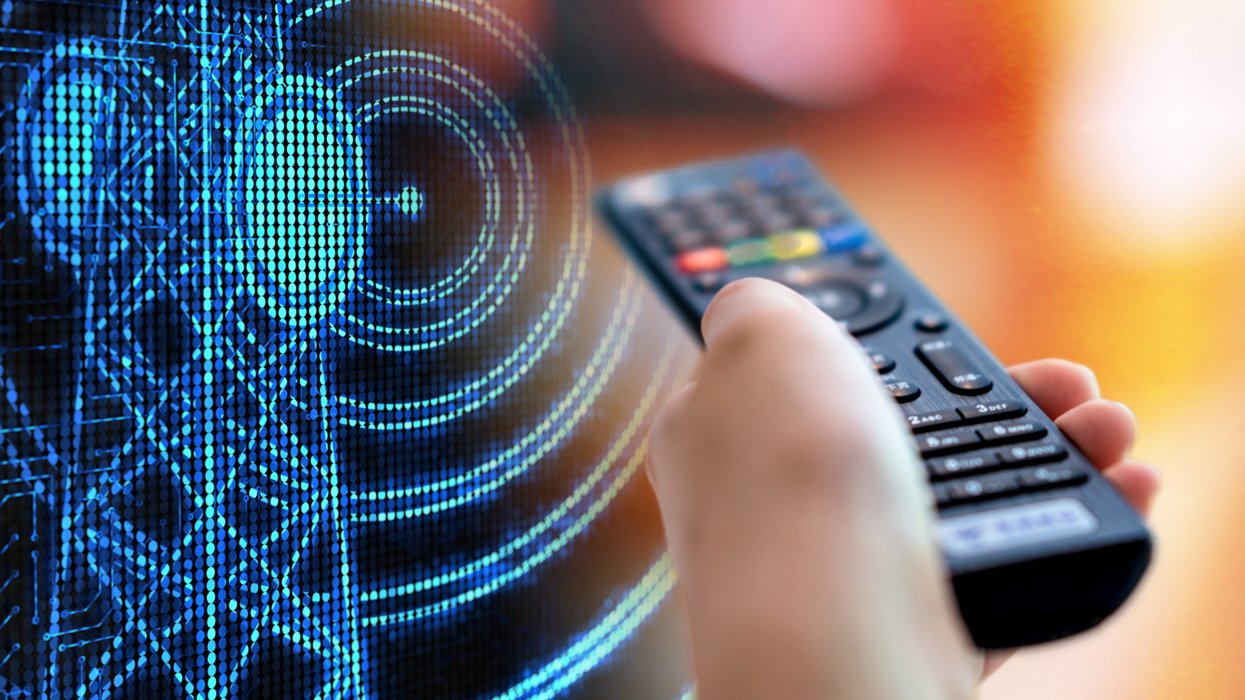 a hand holds a remote control pointed at a television with a digital illustration of a TV mast in the background