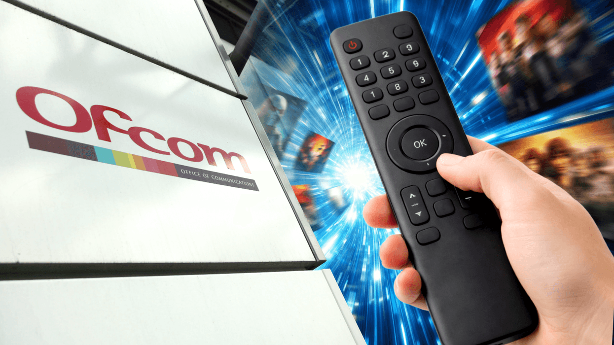 a hand holds a remote control with streaming shows pictured in the background from netflix, prime video, and more