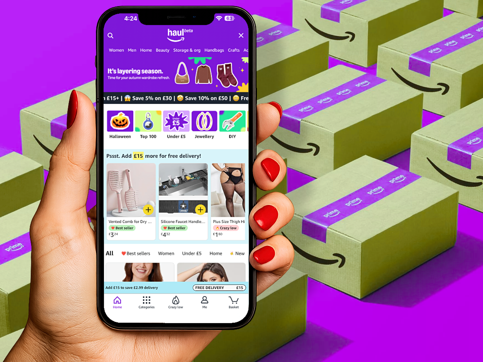 a hand holds a smartphone with the amazon haul shopping section loaded up on-screen