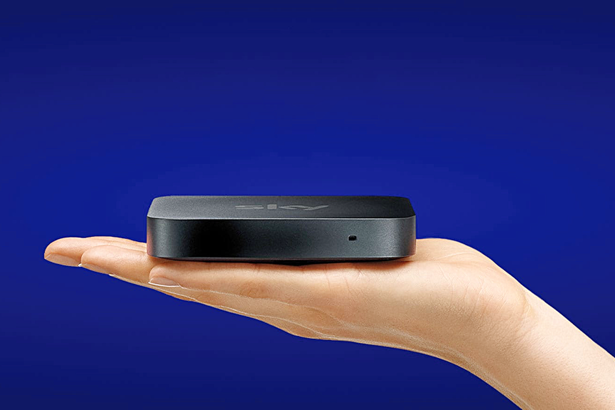 a hand holds out the sky stream box