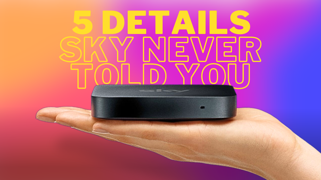 a hand holds the sky stream tv box on a colourful background