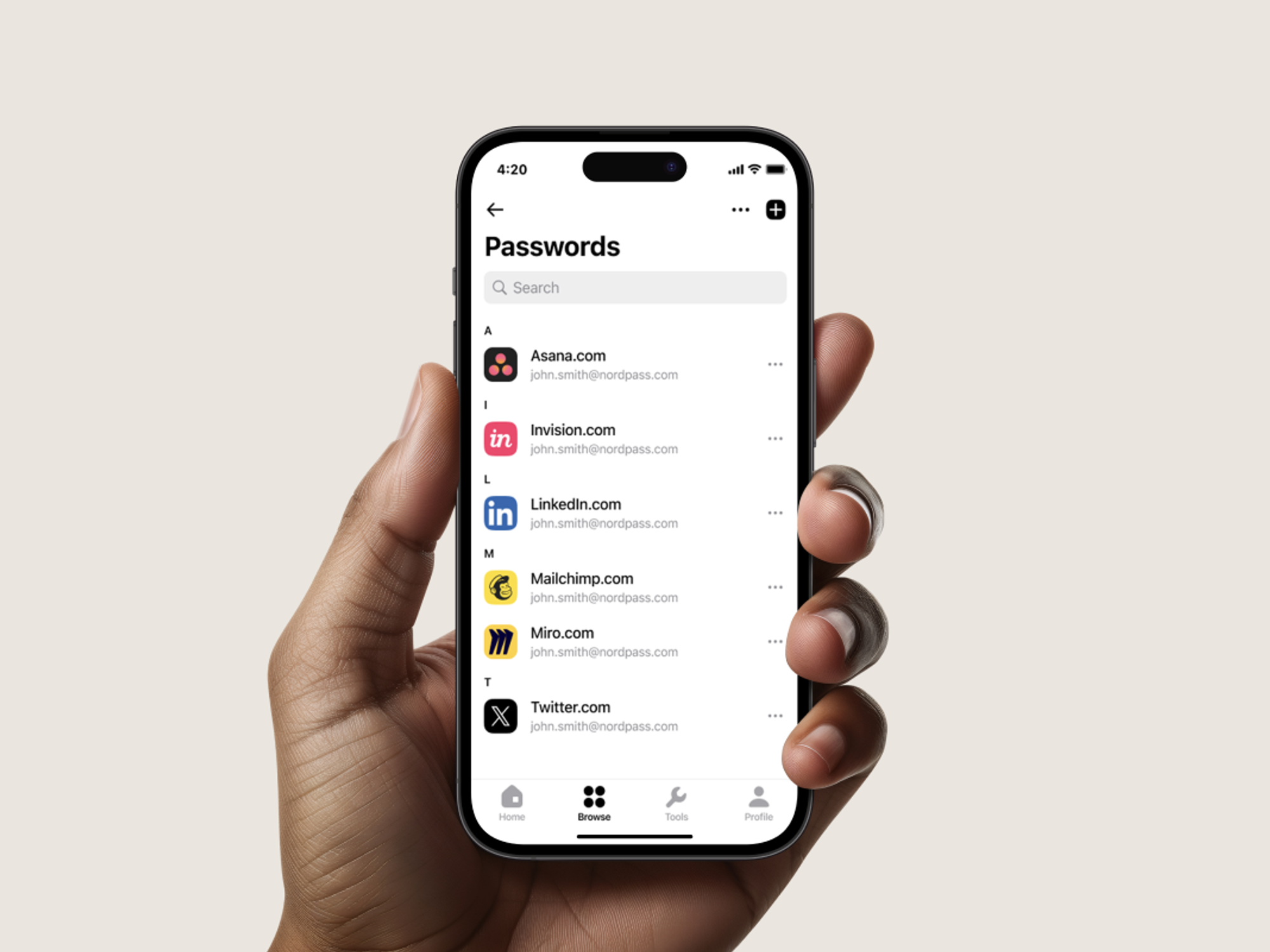 a hand holds up a smartphone with the NordPass app open and a list of all saved passwords and accounts