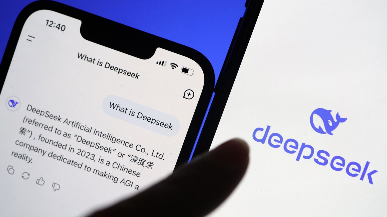 a hand taps on the deepseek icon on iphone and uses the ai chatbot