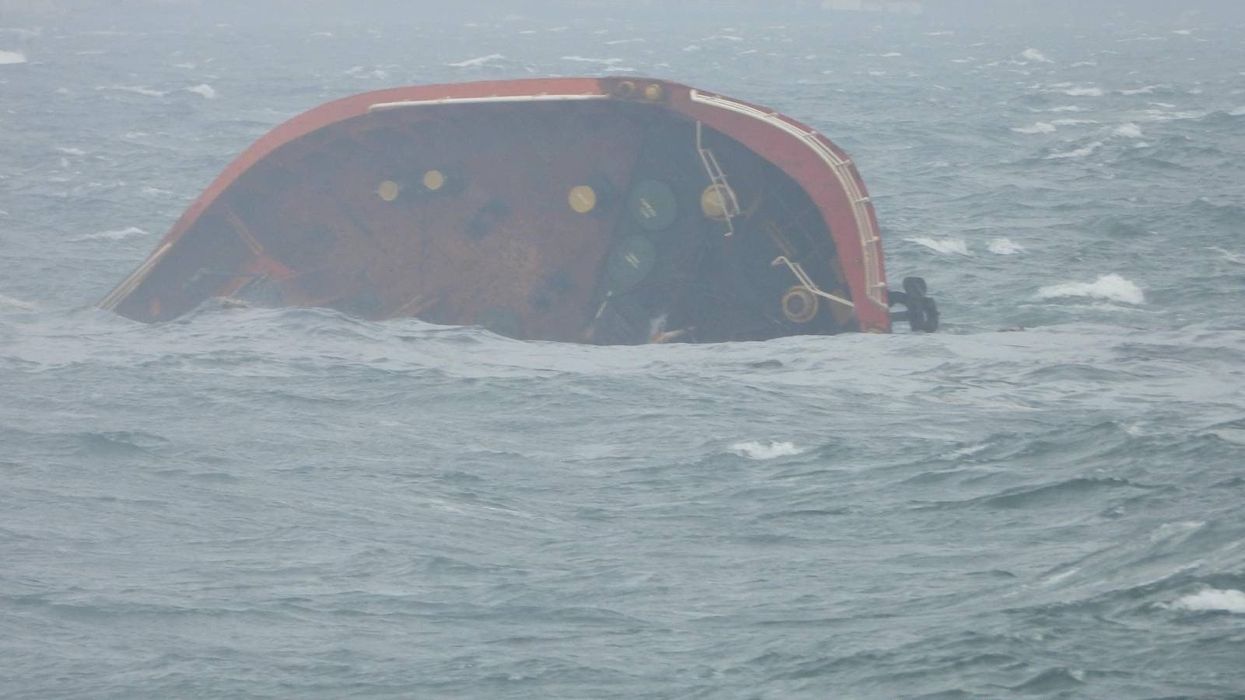 A handout photo released by the Philippine Coast Guard shows the tip of MT Terra Nova protruding in Manila Bay, Philippines