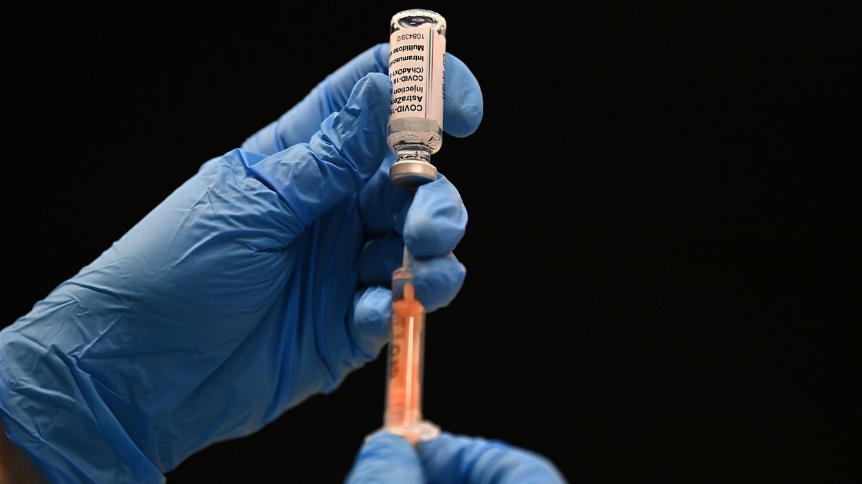 A healthcare professional draws up a dose of the Oxford/AstraZeneca Covid-19 vaccine