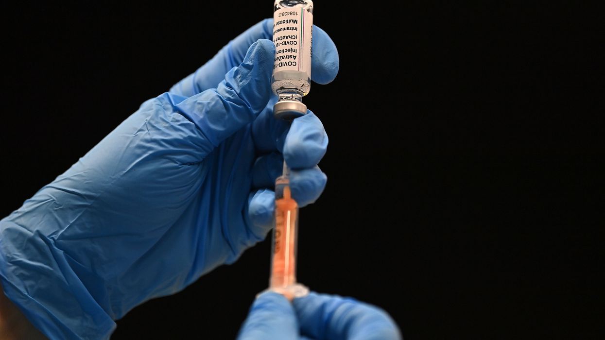 A healthcare professional draws up a dose of the Oxford/AstraZeneca Covid-19 vaccine