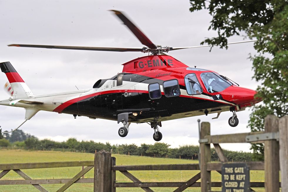 A helicopter arrives at Daylesford House