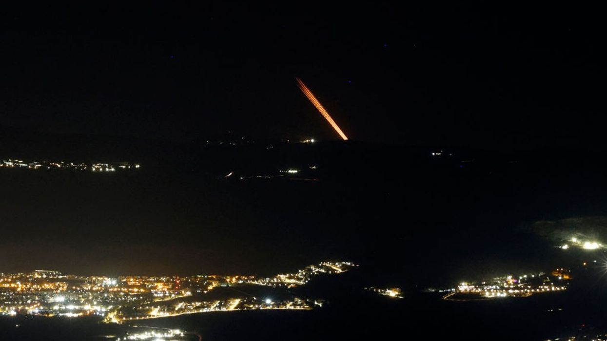 Hezbollah rocket strikes Israel's main airport as group launches 120-missile barrage across border