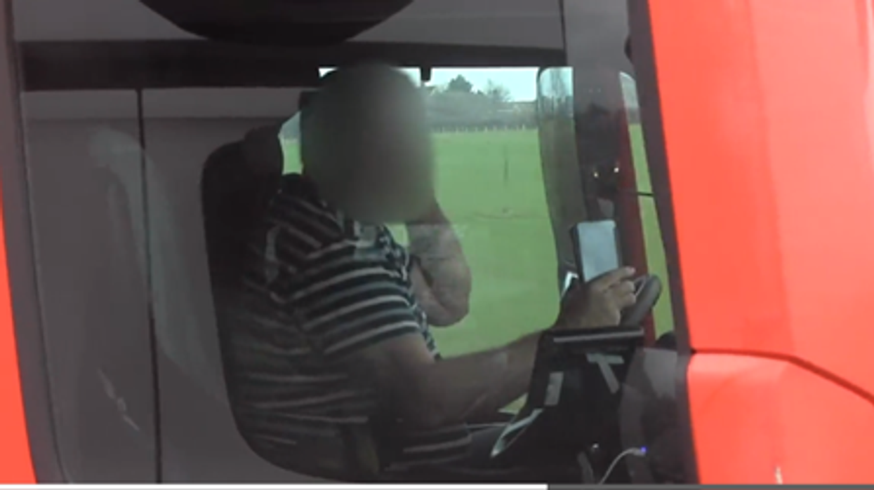 A HGV driver with two phones