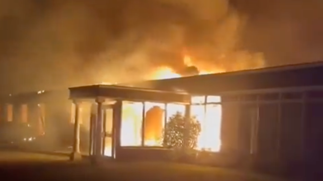 Migrant hotel goes up in FLAMES as huge blaze rips through 19th Century building