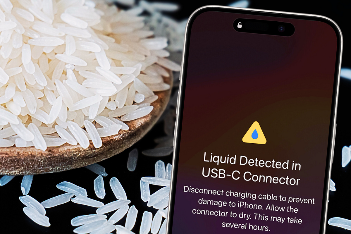a iphone is pictured with a warning about liquid in the charging port with rice scattered in the background 