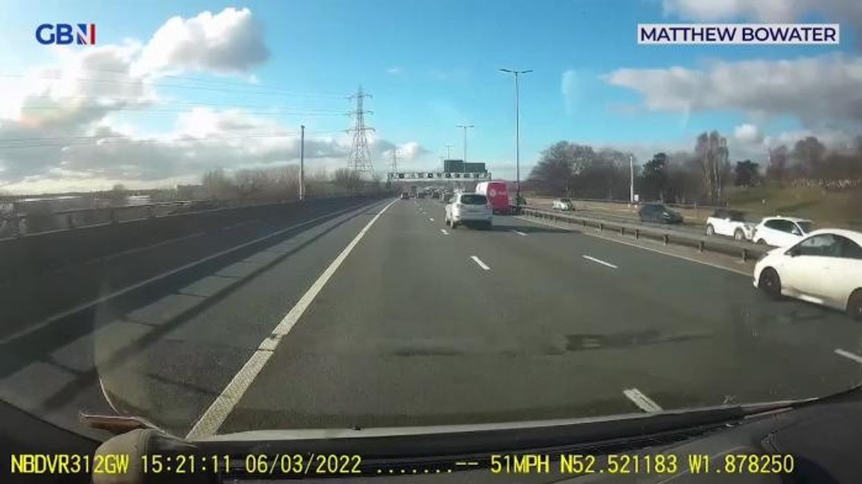 Pensioner on electric wheelchair cruises wrong way down busy motorway leaving drivers bewildered