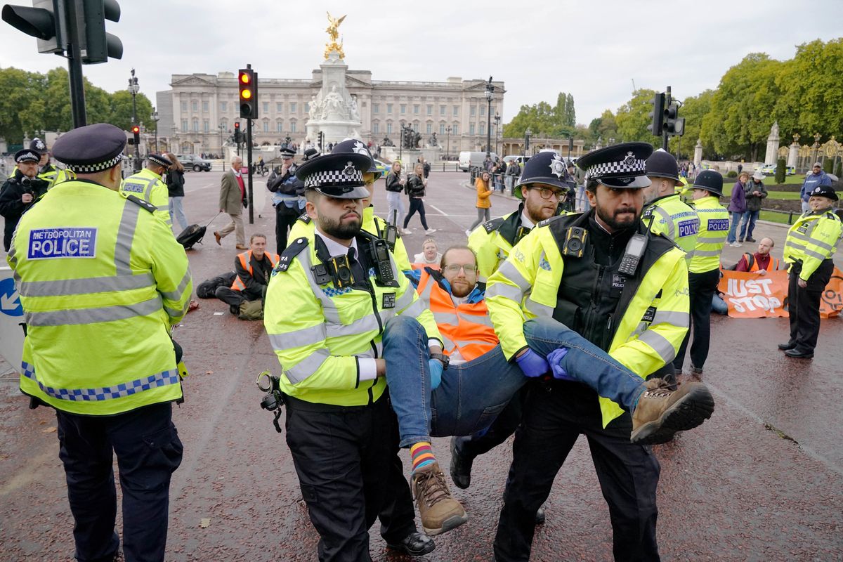 A Just Stop Oil protester is taken away by police