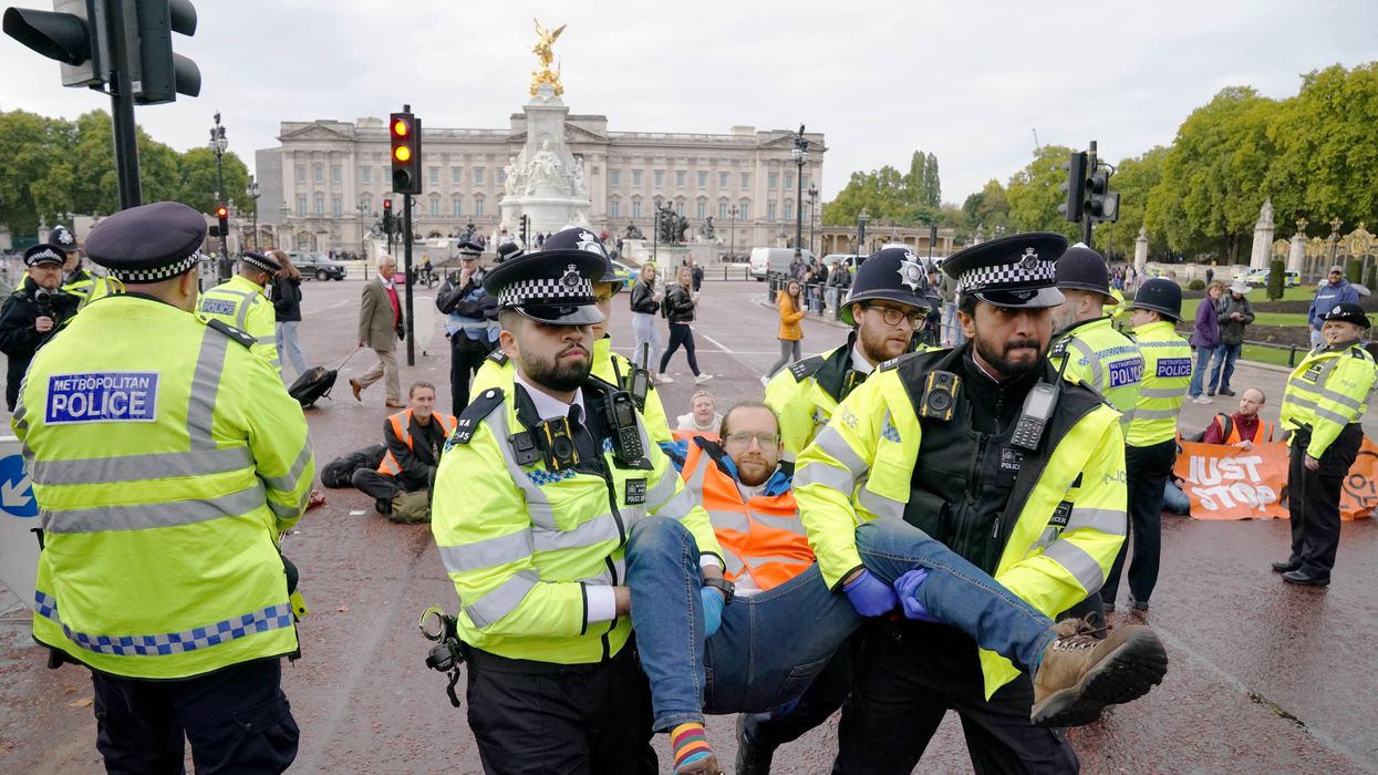 A Just Stop Oil protester is taken away by police