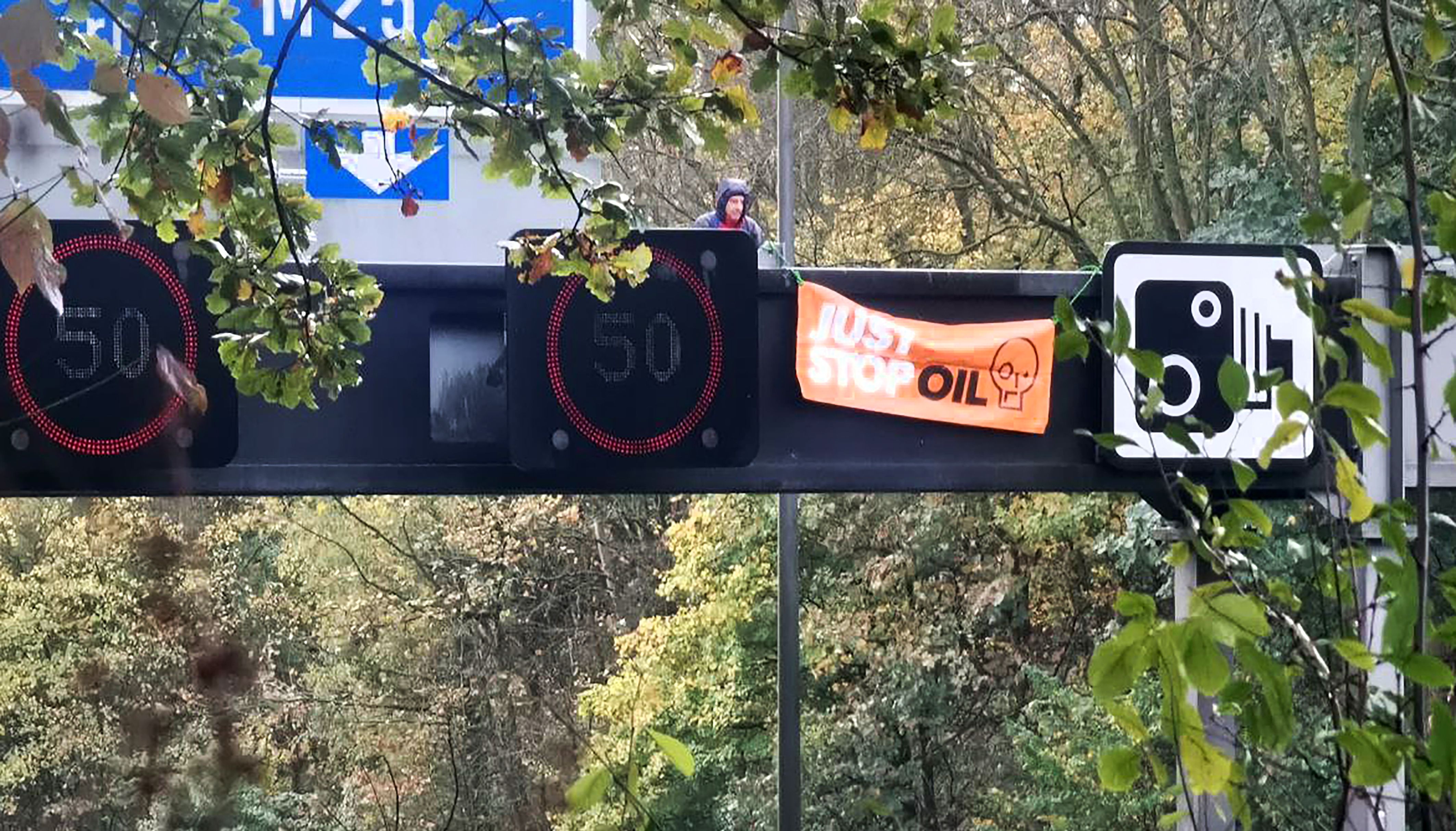 A Just Stop Oil protestor climbed a gantry on Tuesday
