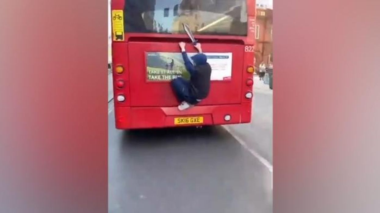 WATCH - Shocking moment knife-wielding 'bus surfer' rides through Brighton