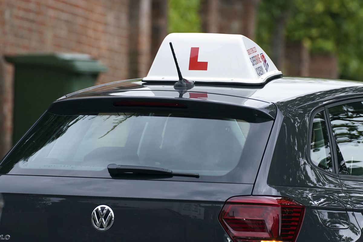 A learner driver drives down a street in Winchester, Hampshire