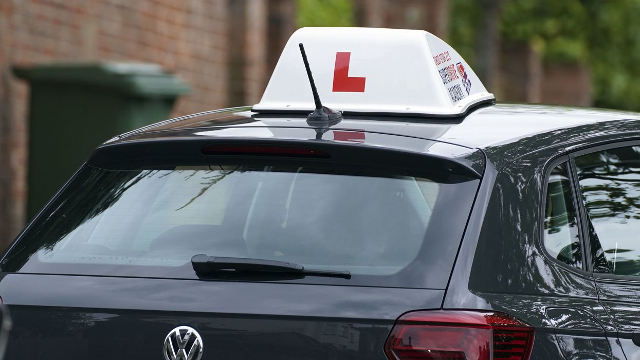 A learner driver drives down a street in Winchester, Hampshire