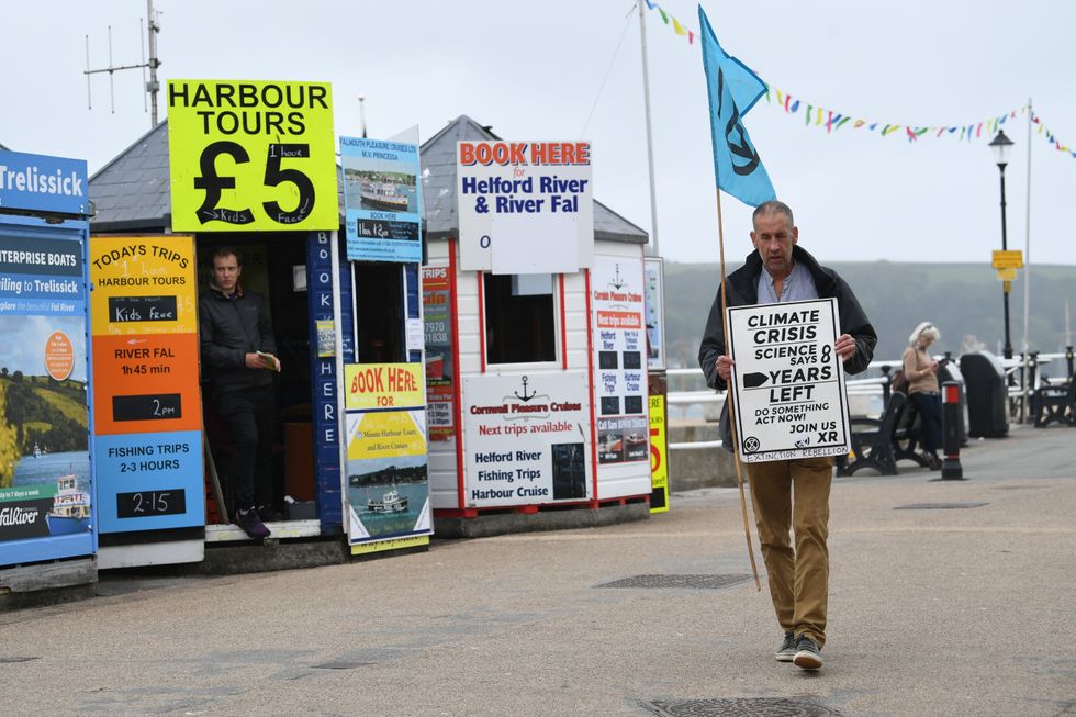 A lone Extinction Rebellion protester at Falmouth Harbour in Falmouth.