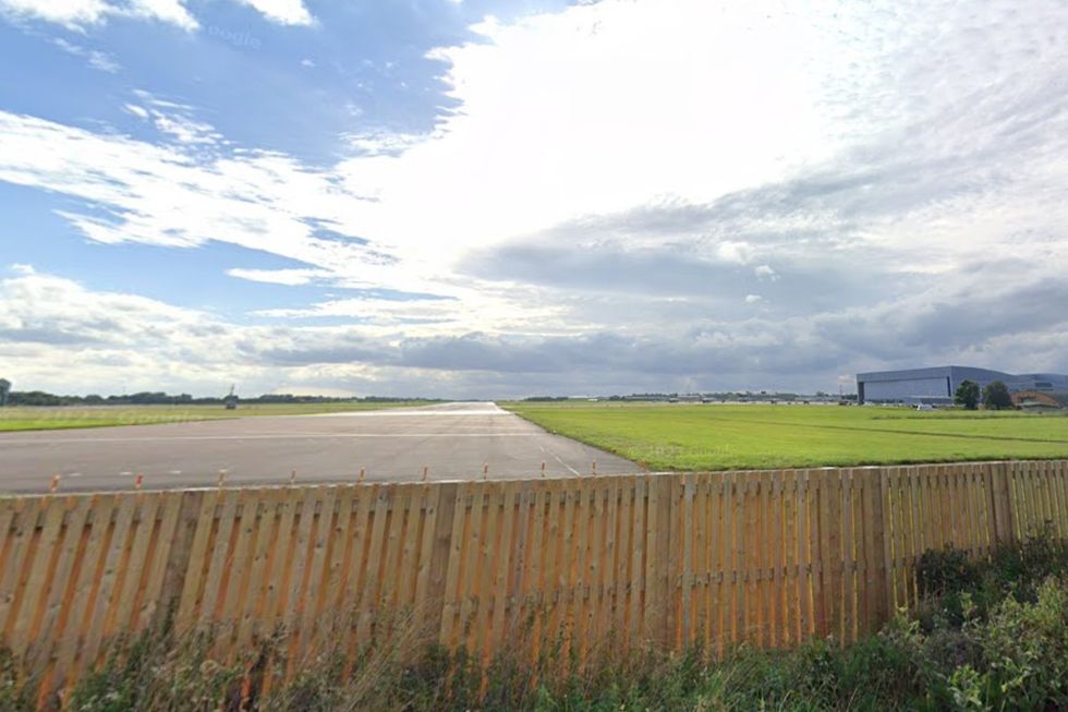 A long stretch of fence is not covered by barbed wire and stands at just 6ft off the ground