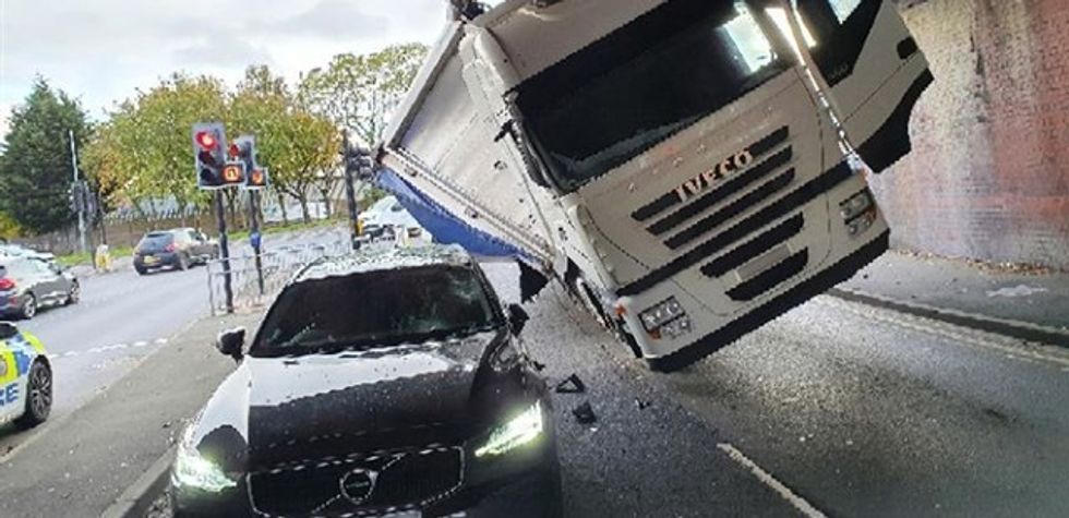 A lorry crashing into a Volvo