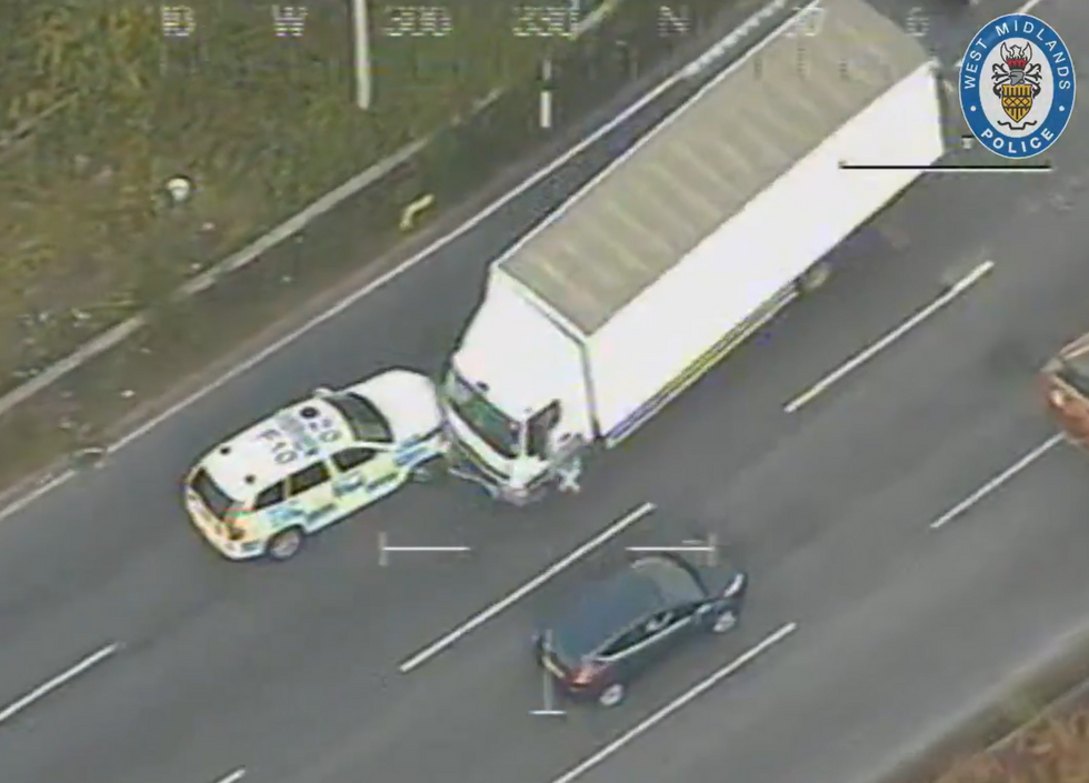 A lorry has been filmed smashing into a car in a head-on collision as it drove on the wrong side of the M42