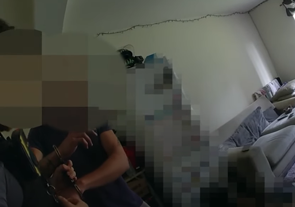 A man being arrested on suspicion of being involved in the Epping migrant hotel protests