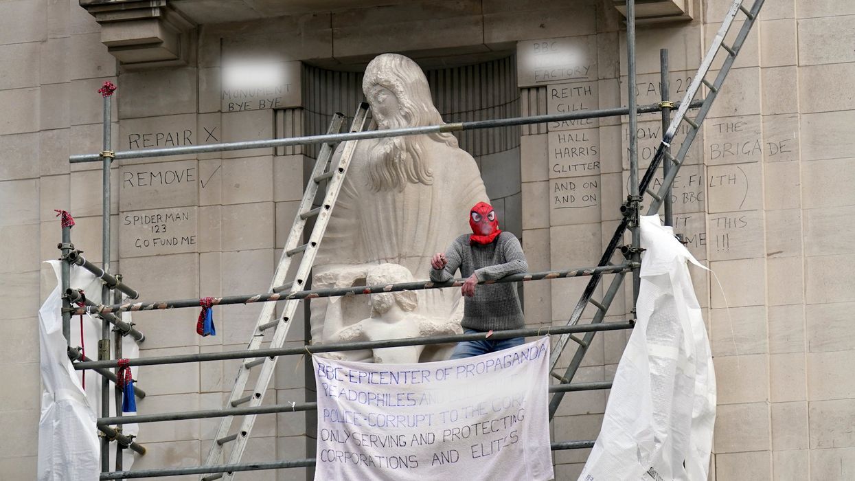 A man dressed as Spiderman has scaled BBC HQ