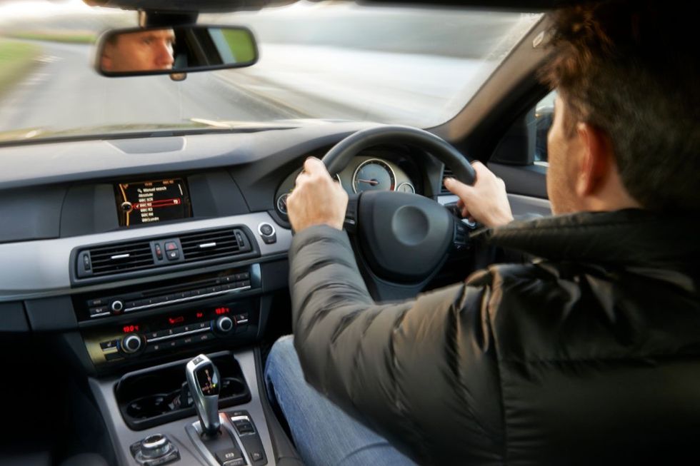 A man driving a car