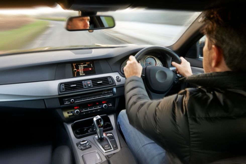 A man driving a car