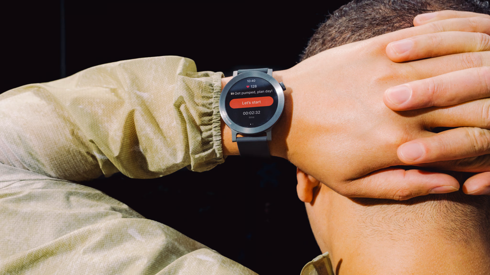 a man has their hands behind their head with the always-on display on the CMF by Nothing Watch 3 Pro