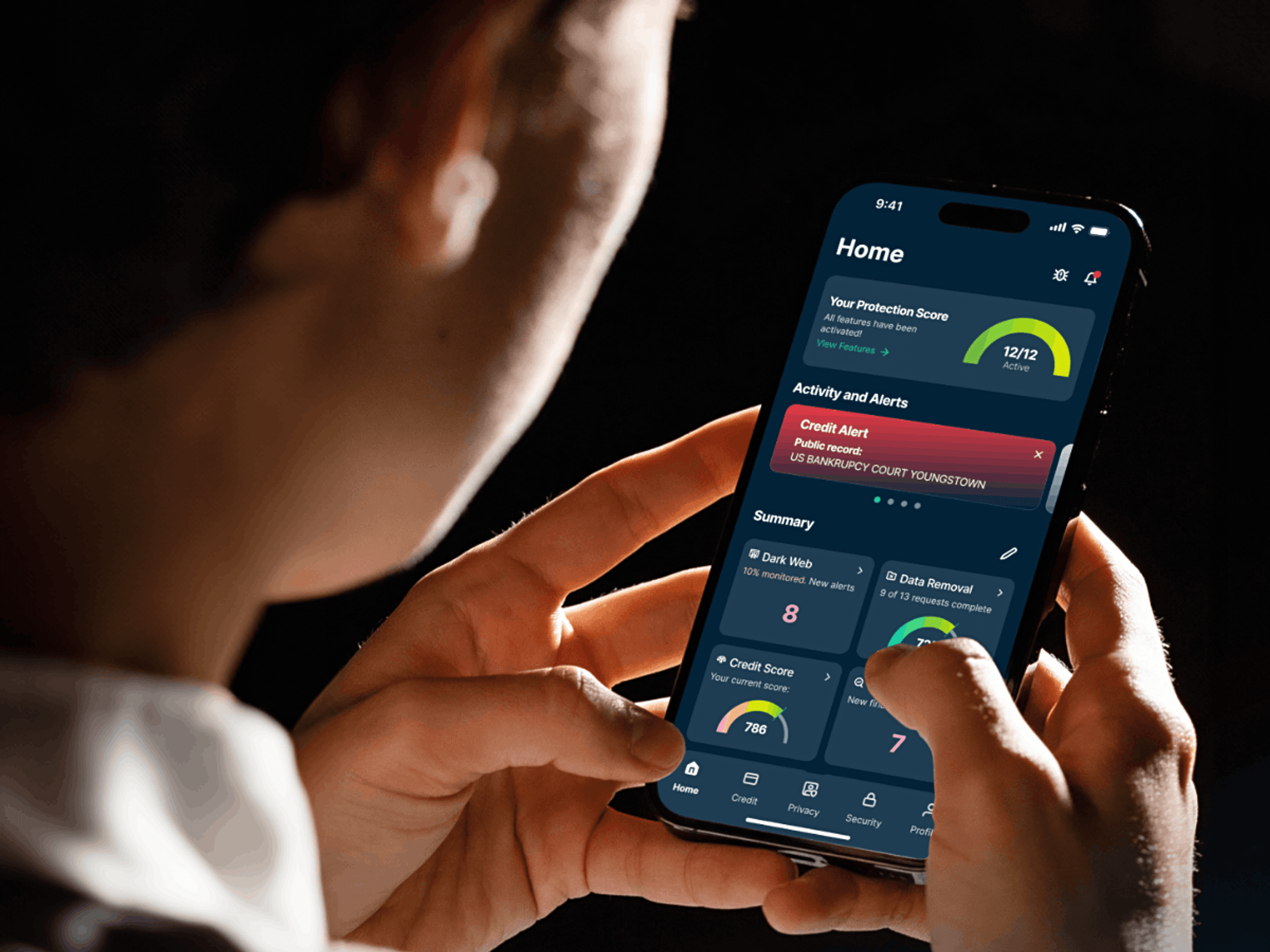 a man holds an iPhone in both hands with ExpressVPN shown on-screen