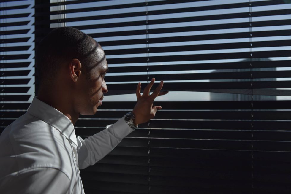 A man looking out a window