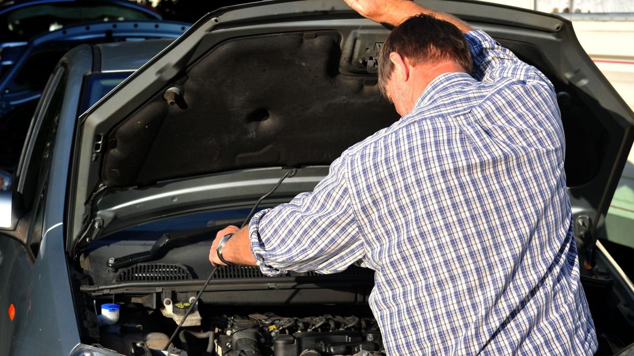 A man repairing his car